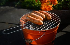 charcoal grill with sausage